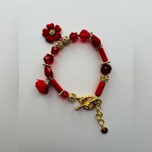 Red Floral Charm Bracelet with Tassel Accent